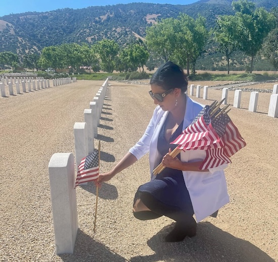 Asm Bains placing an American flag